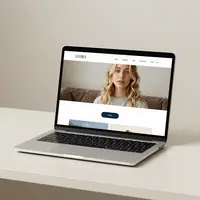 Laptop showing a simple website landing page.